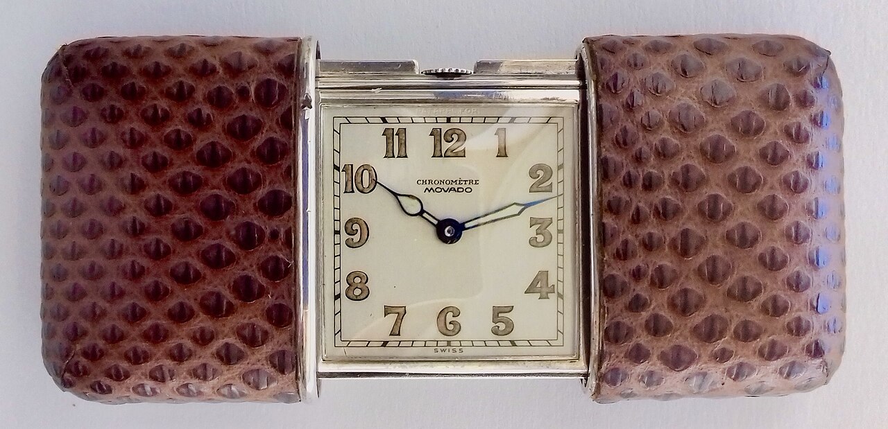 Precision mechanical chronometer watch escapement gears and balance wheel.