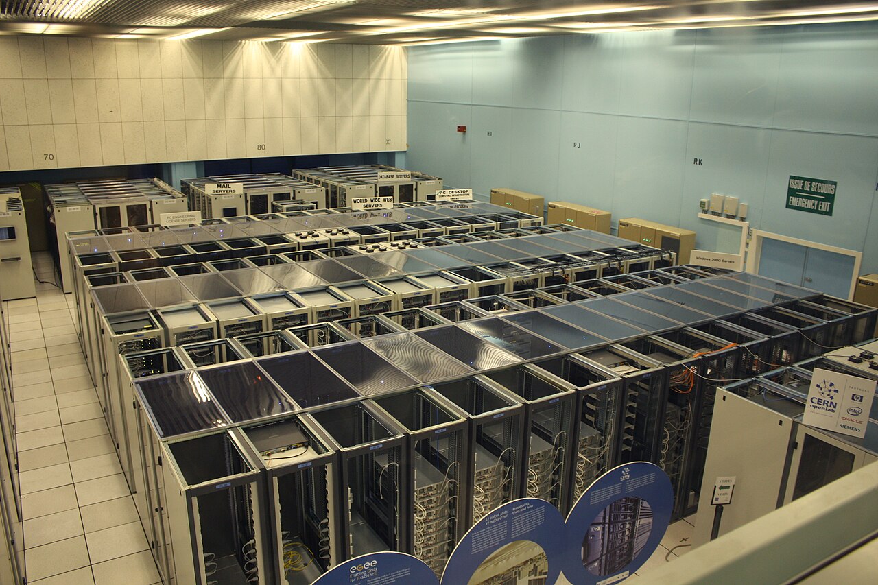 Quiet datacenter corridor with server racks and status indicators running unattended.